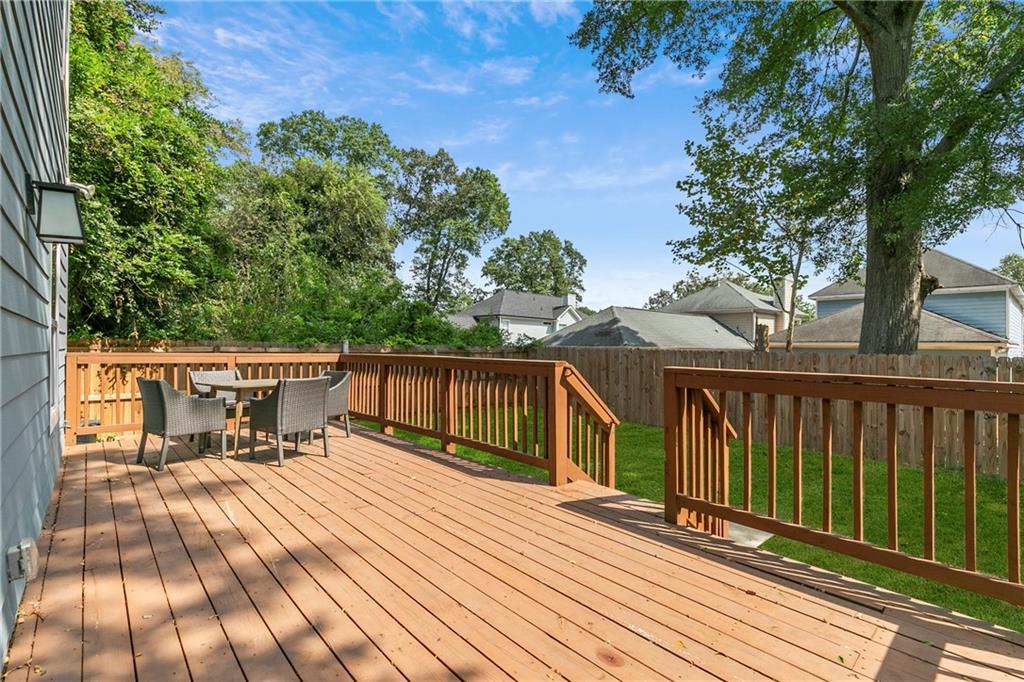 973 Mayson Turner Road Northwest Atlanta, GA 30314 - Photo 33 of 38 a view of balcony with deck and outdoor seating