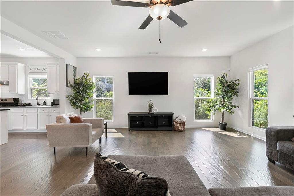 973 Mayson Turner Road Northwest Atlanta, GA 30314 - Photo 5 of 38 a living room with furniture and a flat screen tv