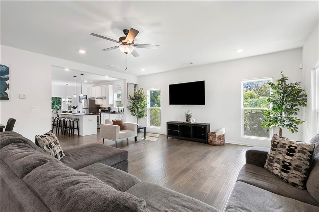 973 Mayson Turner Road Northwest Atlanta, GA 30314 - Photo 6 of 38 a living room with furniture and a flat screen tv