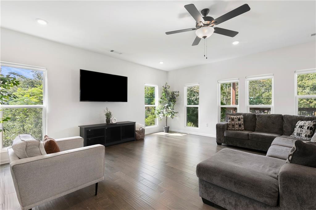 973 Mayson Turner Road Northwest Atlanta, GA 30314 - Photo 7 of 38 a living room with furniture and a flat screen tv