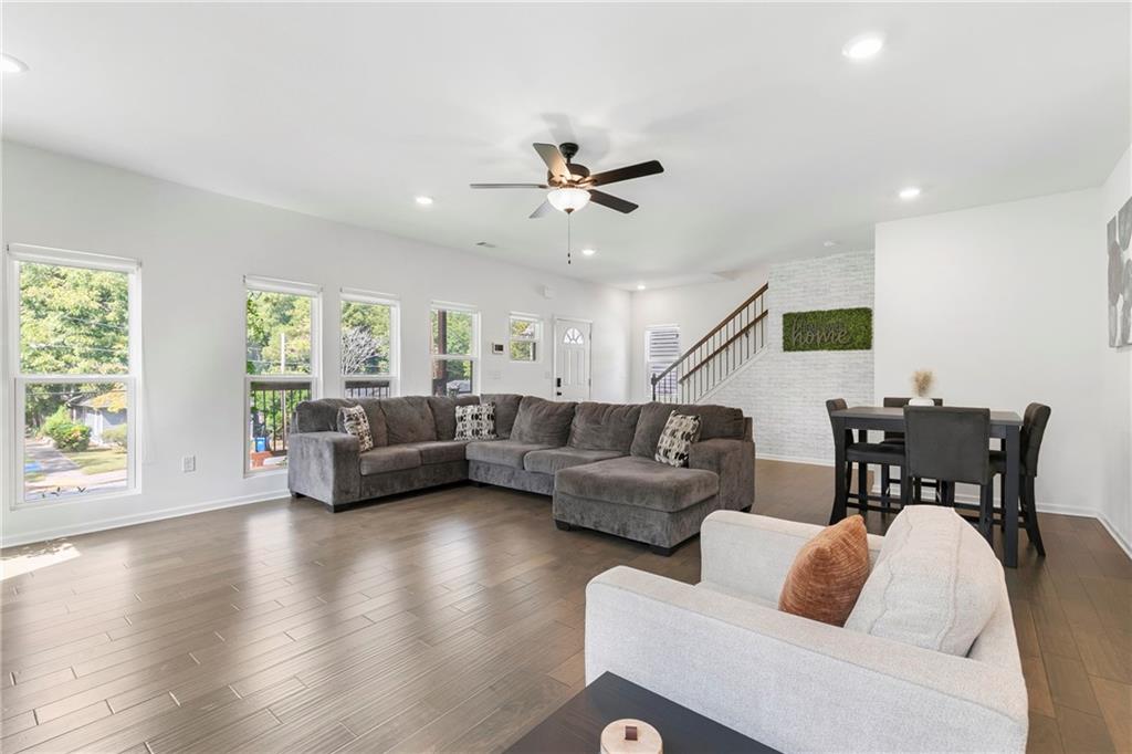 973 Mayson Turner Road Northwest Atlanta, GA 30314 - Photo 8 of 38 a living room with furniture wooden floor and a window