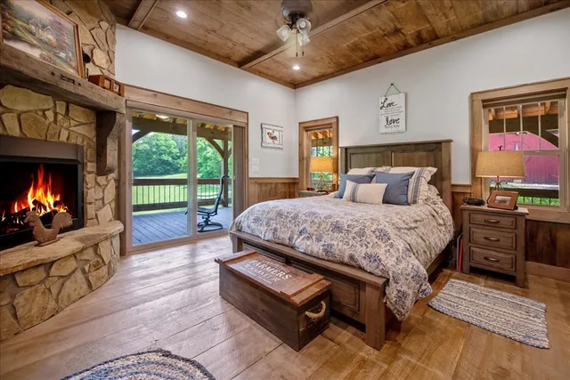 a kitchen with stainless steel appliances granite countertop a stove a sink and white cabinets