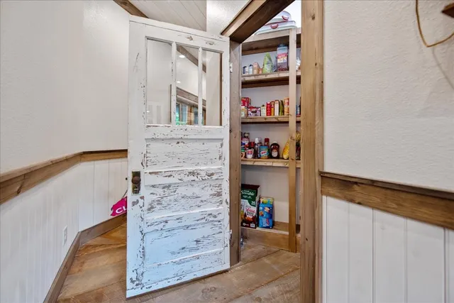 a bathroom with a granite countertop toilet sink and mirror