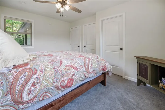 a livingroom with lounge chair and a window