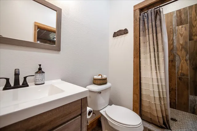 a view of a big yard with lots of green space and mountain view