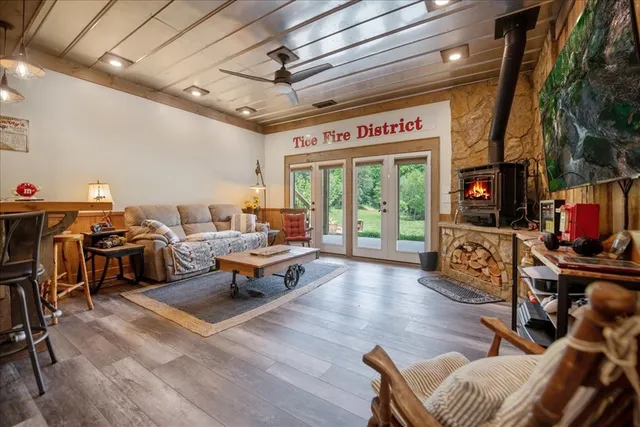 a living room with lots of furniture and a flat screen tv