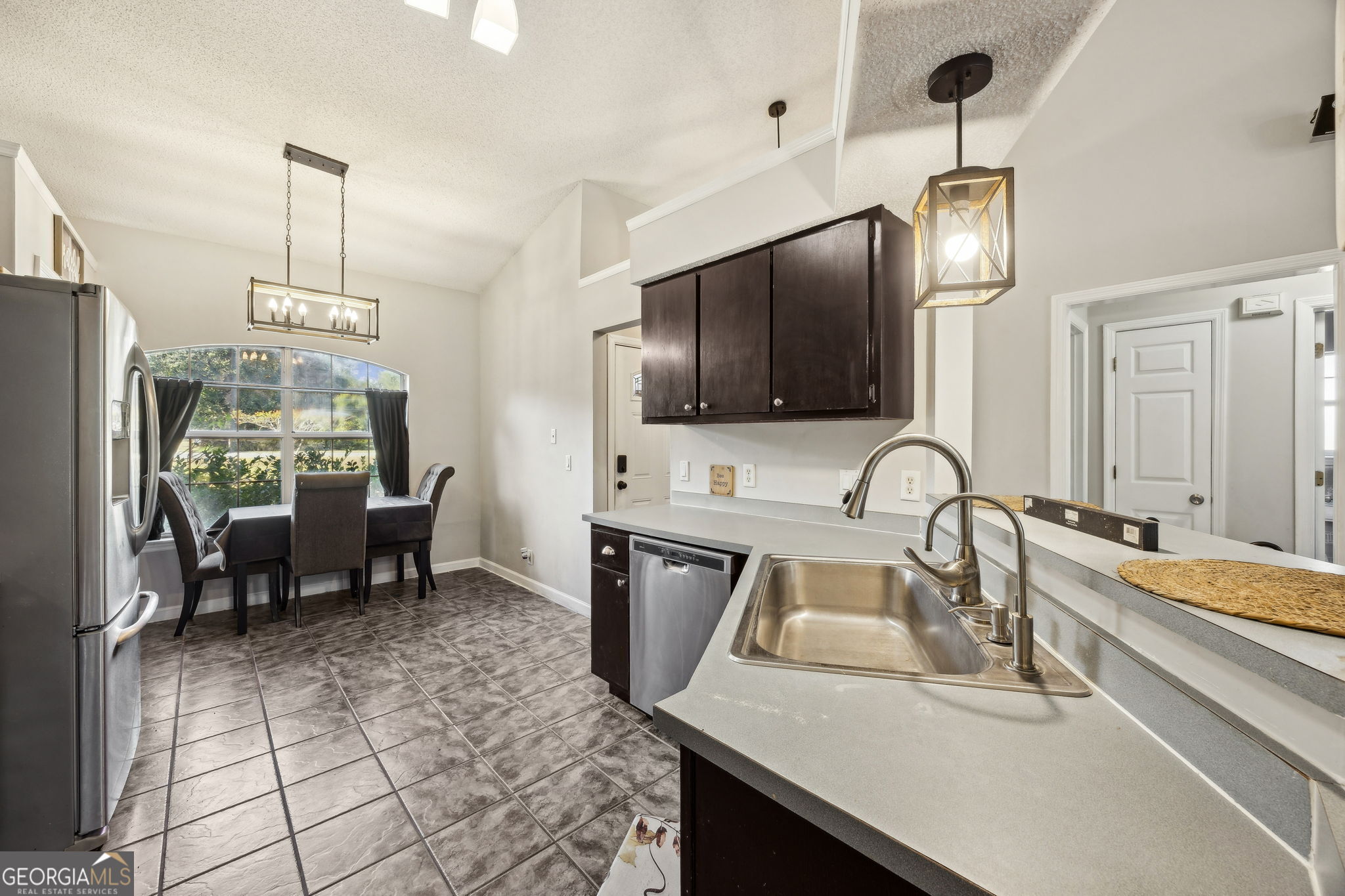 1720 Point Peter Road St. Marys, GA 31558 - Photo 21 of 93 a kitchen with sink a counter and chairs