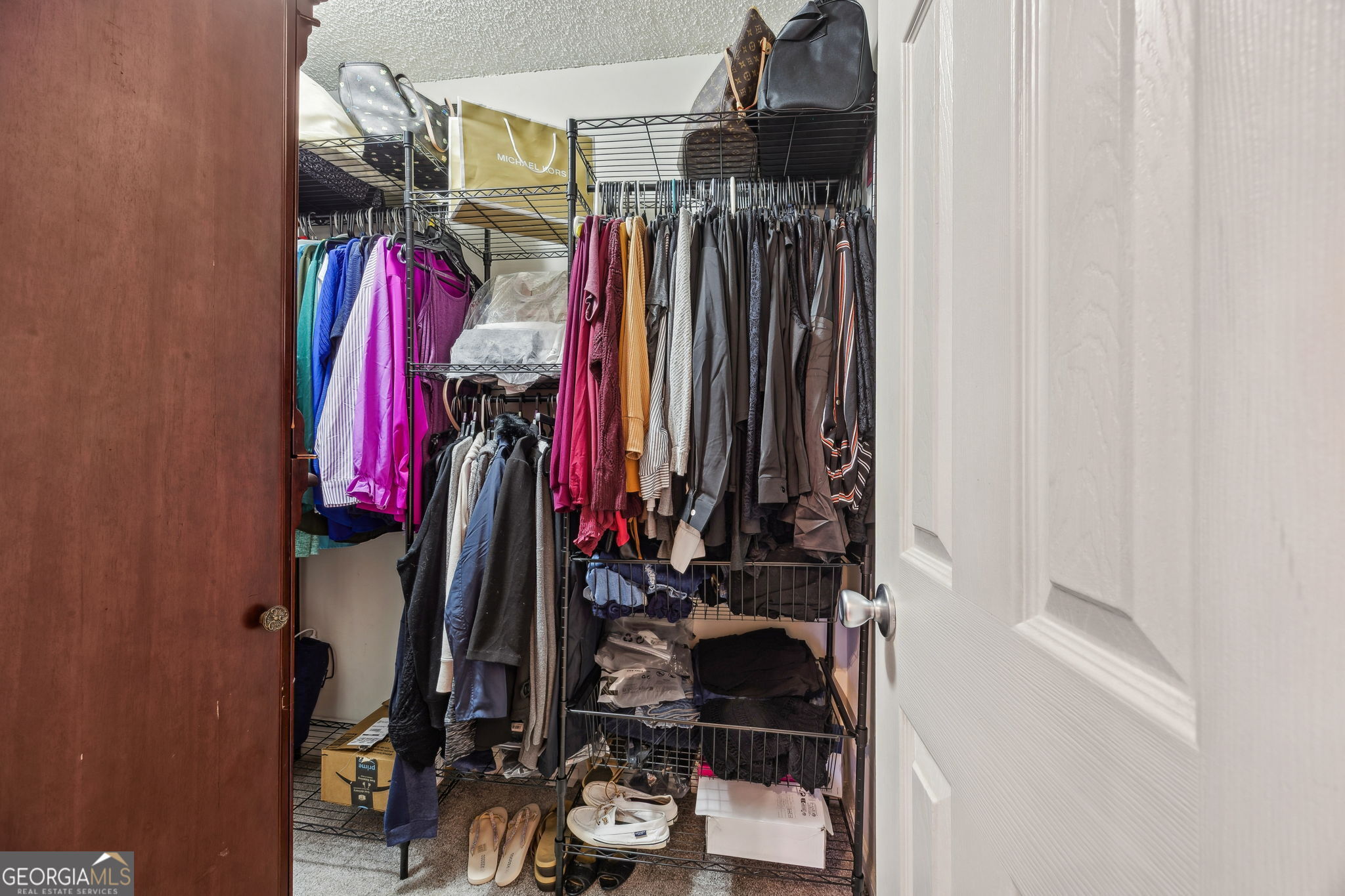 1720 Point Peter Road St. Marys, GA 31558 - Photo 35 of 93 a view of walk in closet with clothes