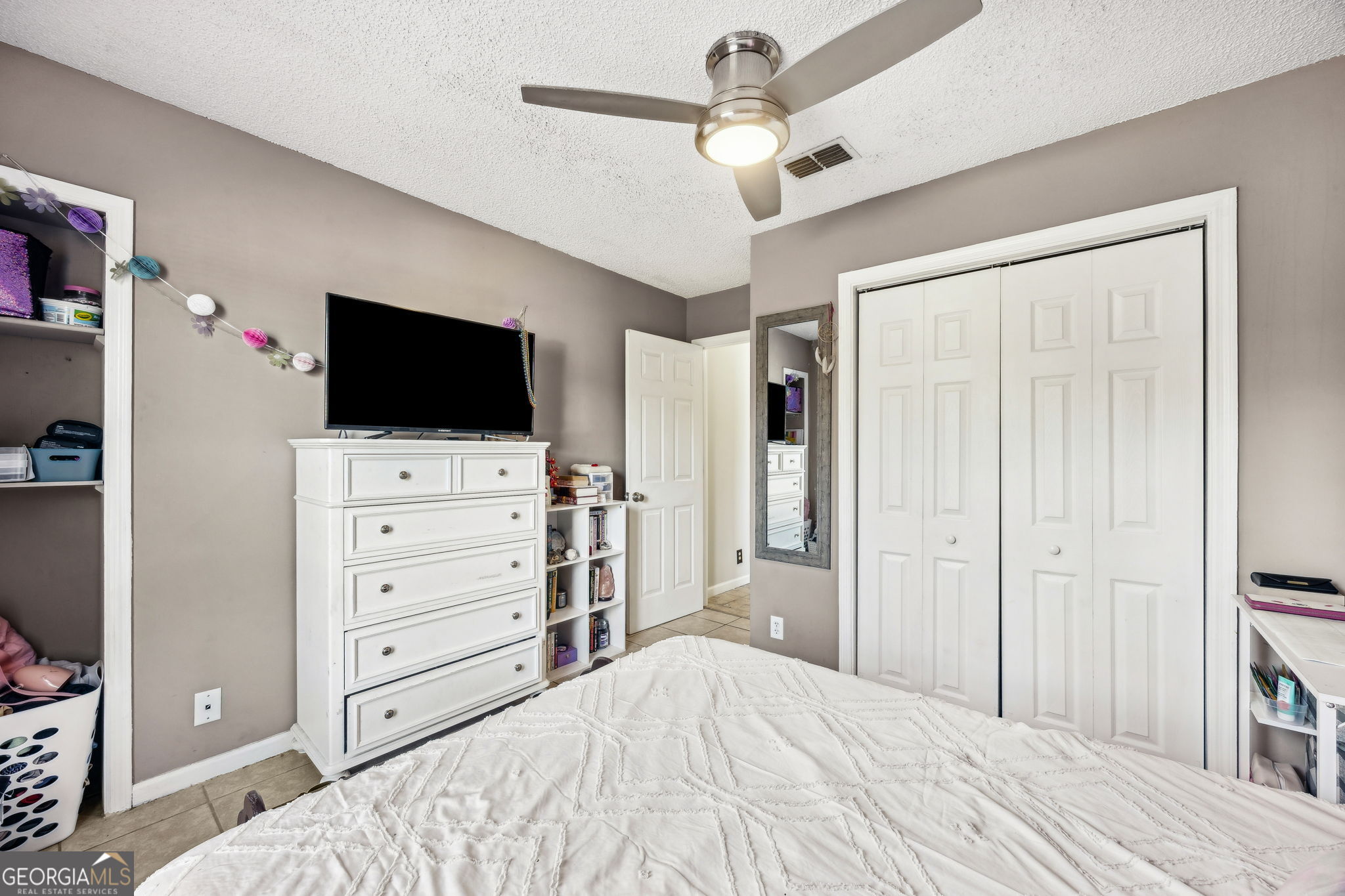 1720 Point Peter Road St. Marys, GA 31558 - Photo 37 of 93 a bedroom with a bed and a flat screen tv