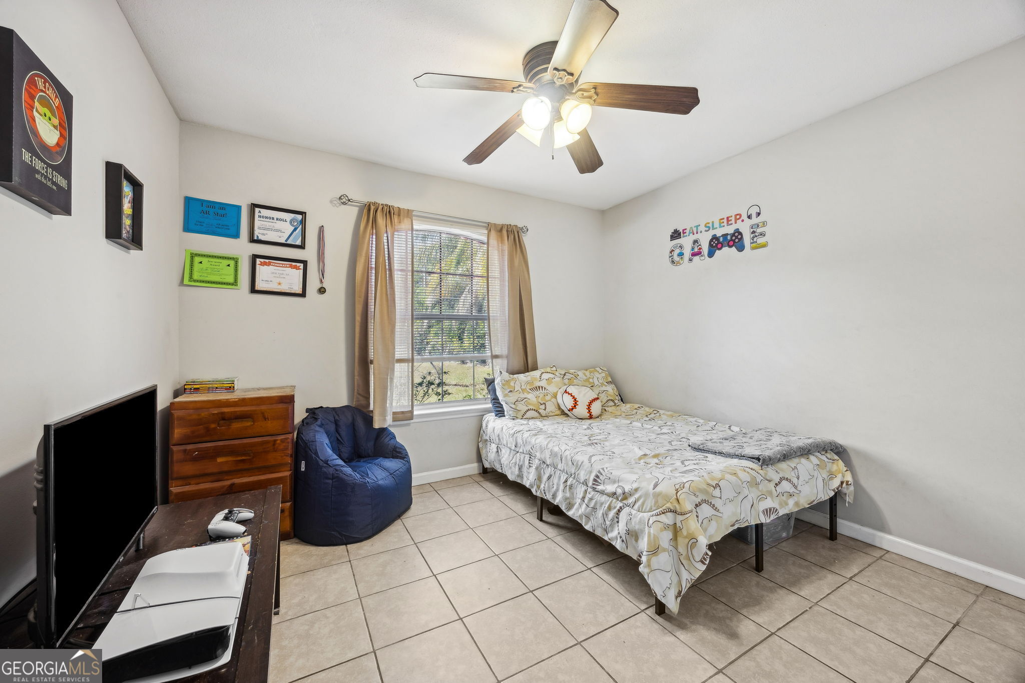 1720 Point Peter Road St. Marys, GA 31558 - Photo 39 of 93 a bedroom with a bed couch and window
