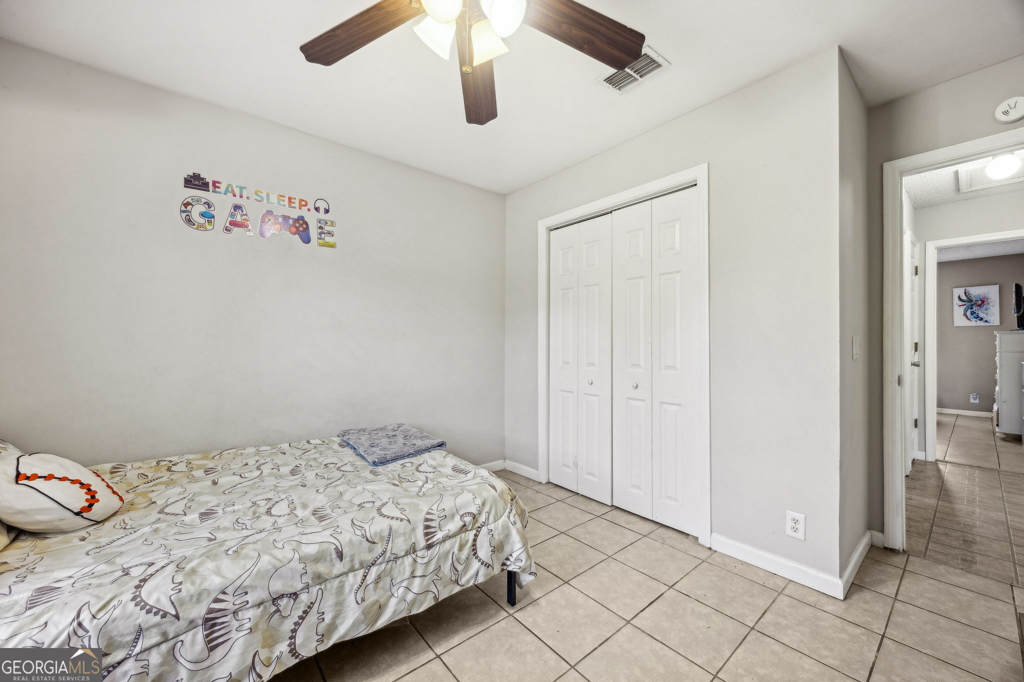 1720 Point Peter Road St. Marys, GA 31558 - Photo 40 of 93 a bedroom with a bed and a painting on the wall
