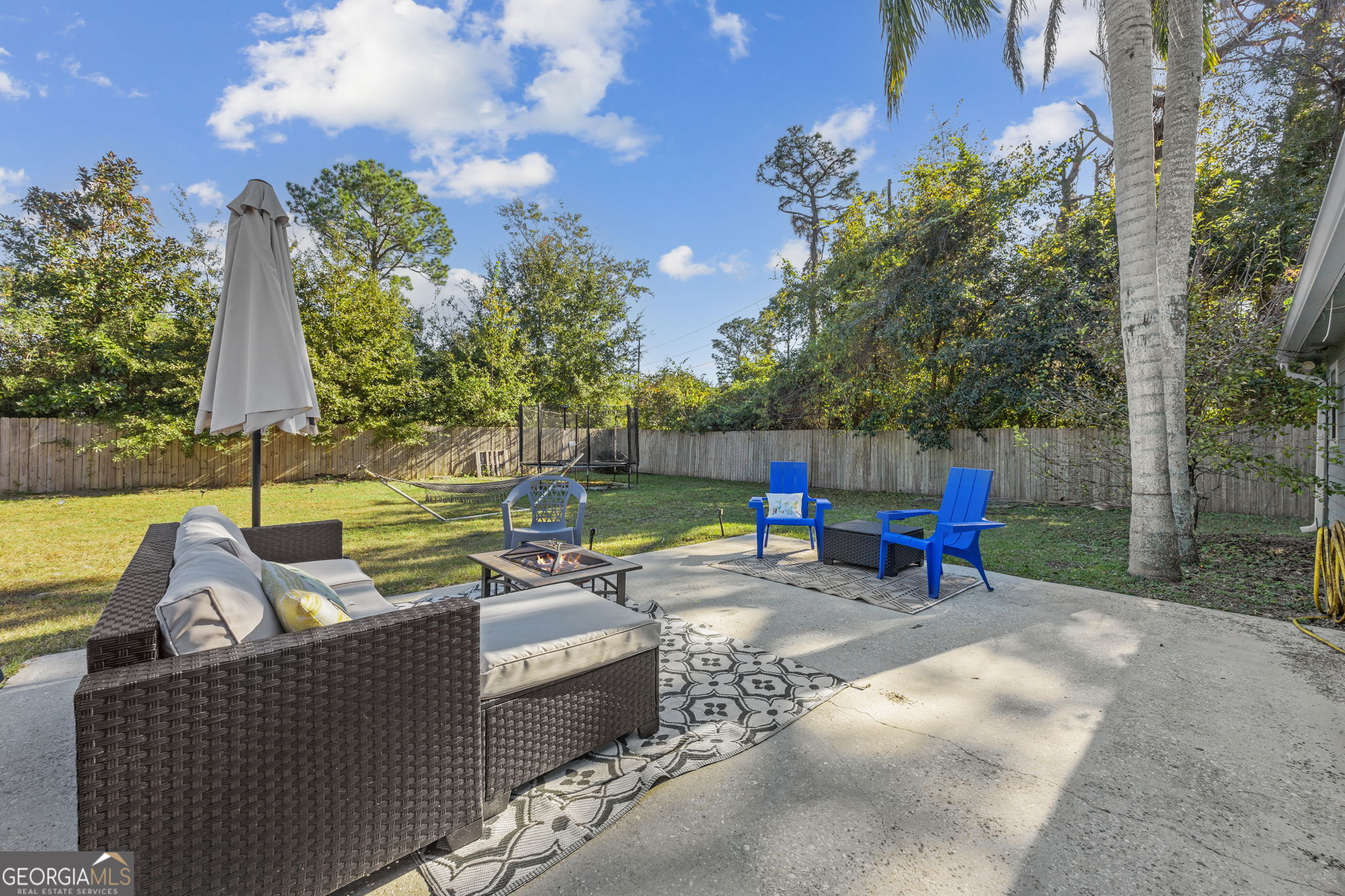 1720 Point Peter Road St. Marys, GA 31558 - Photo 45 of 93 a view of a patio with couches chairs and a fire pit
