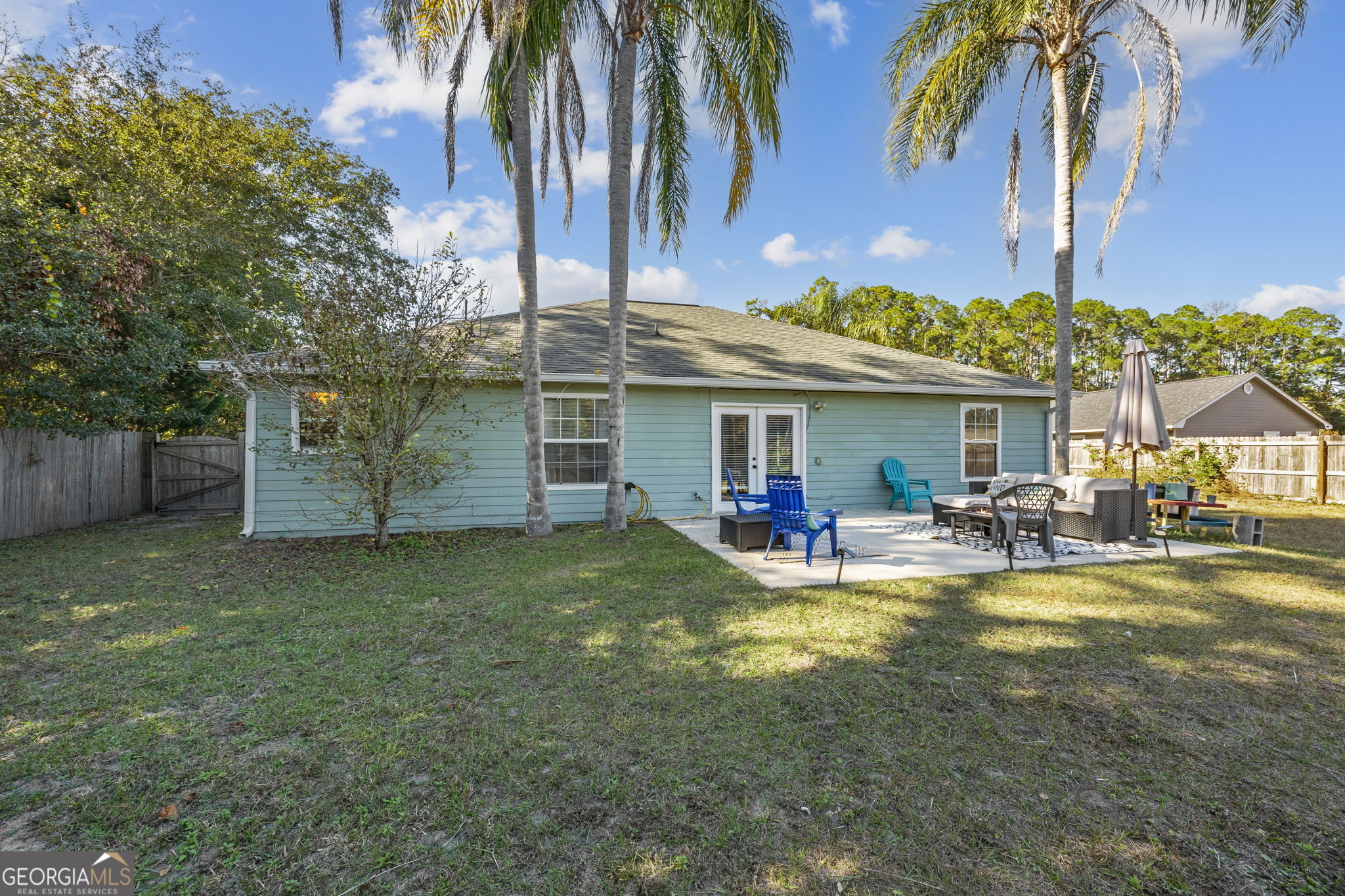 1720 Point Peter Road St. Marys, GA 31558 - Photo 47 of 93 a view of a house with swimming pool and a yard