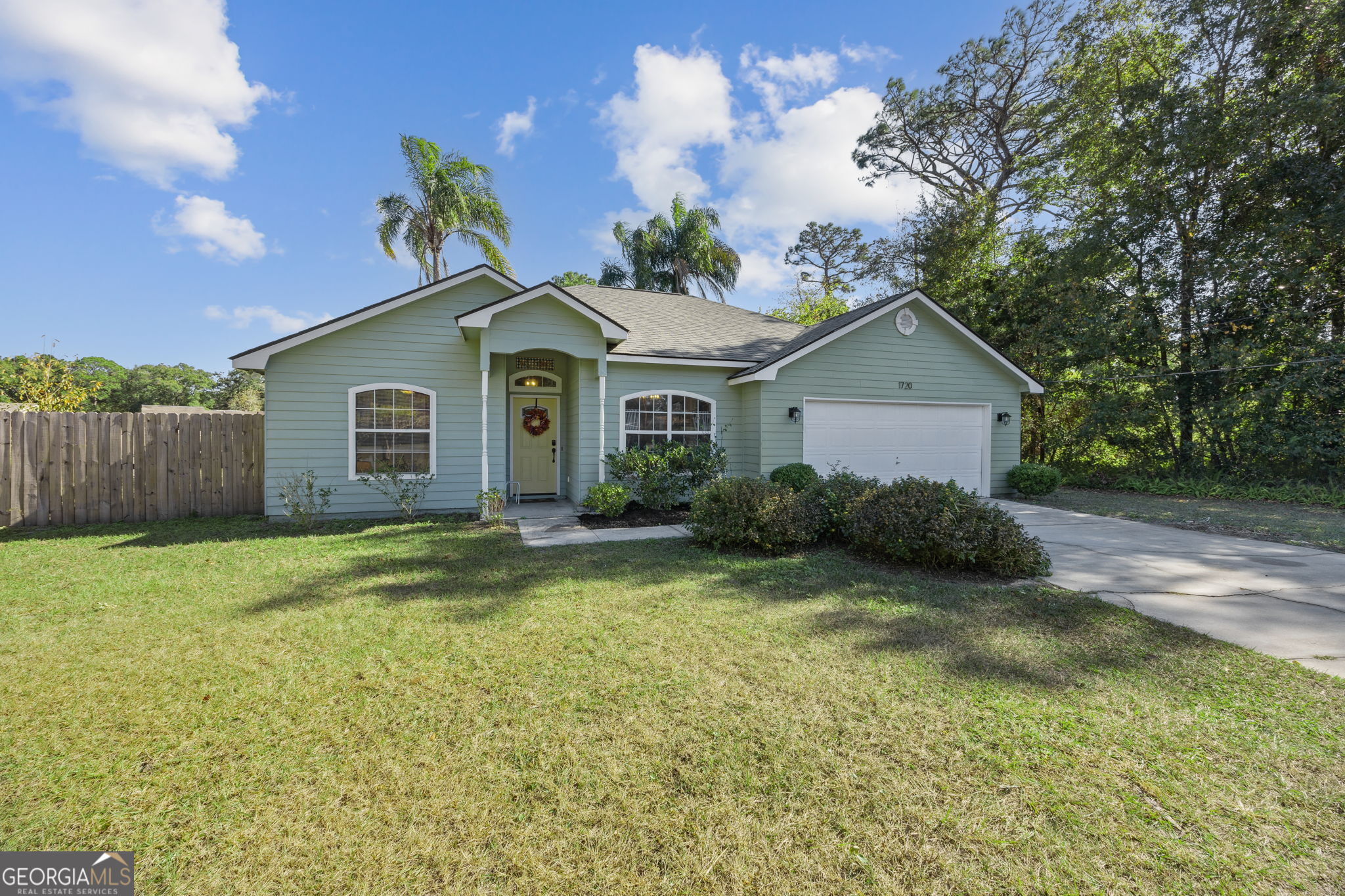 1720 Point Peter Road St. Marys, GA 31558 - Photo 6 of 93 a view of a yard in front of a house with a large tree