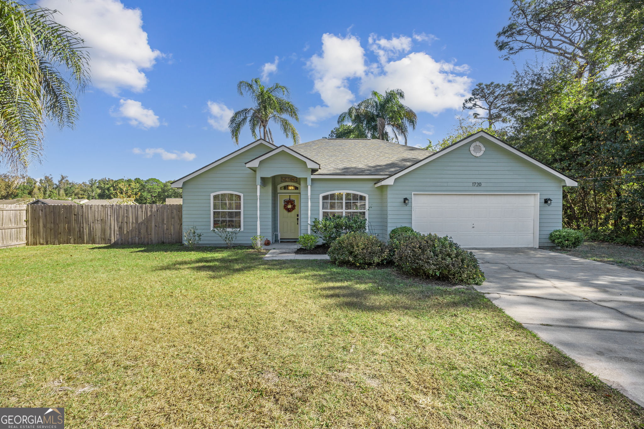 1720 Point Peter Road St. Marys, GA 31558 - Photo 8 of 93 a front view of a house with a garden and yard