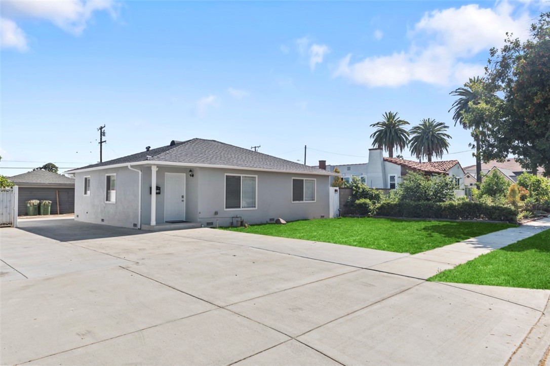 9210 Ralph Street Rosemead, CA 91770 - Photo 1 of 59 a front view of a house with a yard and garage