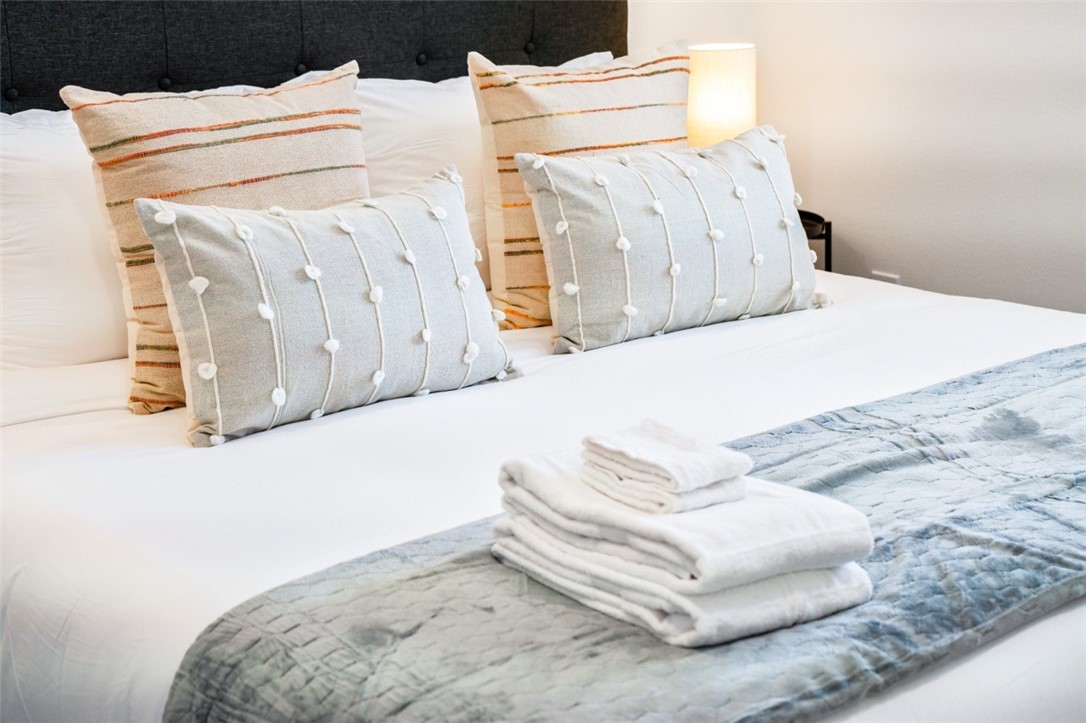 9210 Ralph Street Rosemead, CA 91770 - Photo 14 of 59 a bed with white sheets and pillows on it