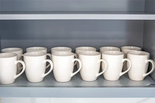 a dining room with furniture and a wooden floor