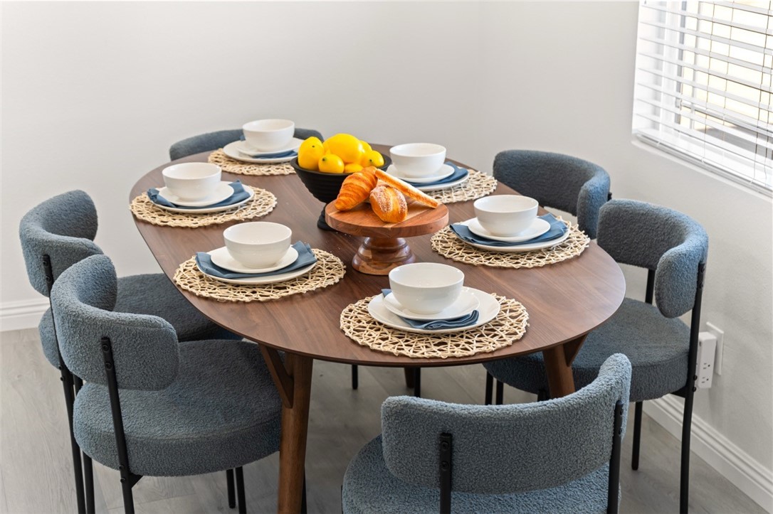 9210 Ralph Street Rosemead, CA 91770 - Photo 26 of 59 a dining room with furniture and a wooden floor