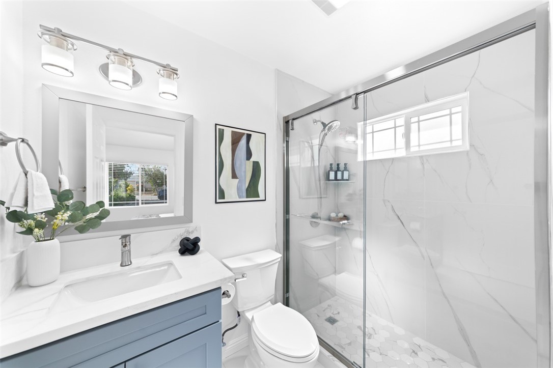 9210 Ralph Street Rosemead, CA 91770 - Photo 34 of 59 a bathroom with a sink a toilet and shower