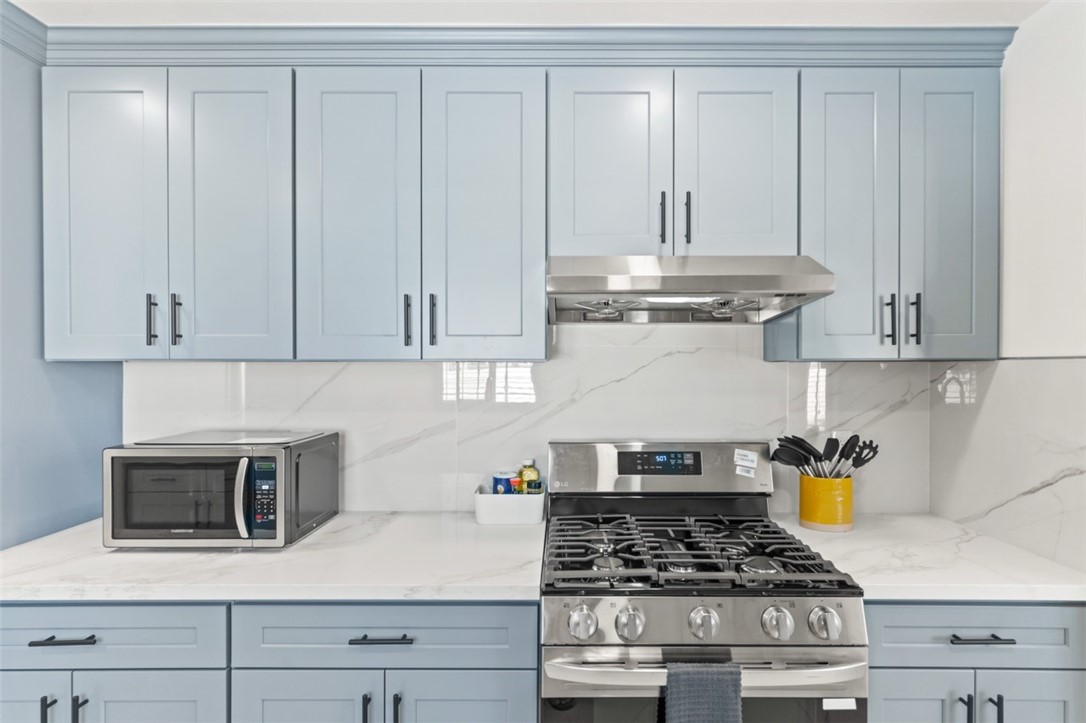 9210 Ralph Street Rosemead, CA 91770 - Photo 43 of 59 a kitchen with white cabinets and appliances