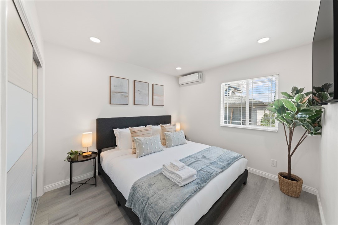 9210 Ralph Street Rosemead, CA 91770 - Photo 45 of 59 a bedroom with a bed and a potted plant