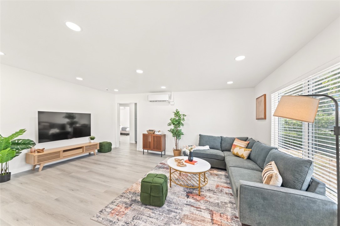 9210 Ralph Street Rosemead, CA 91770 - Photo 52 of 59 a living room with furniture and a flat screen tv