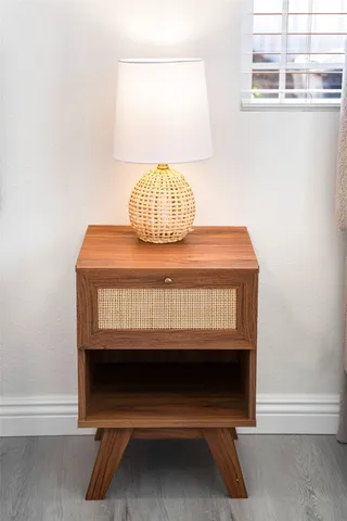 a bedroom with a bed and a white couch