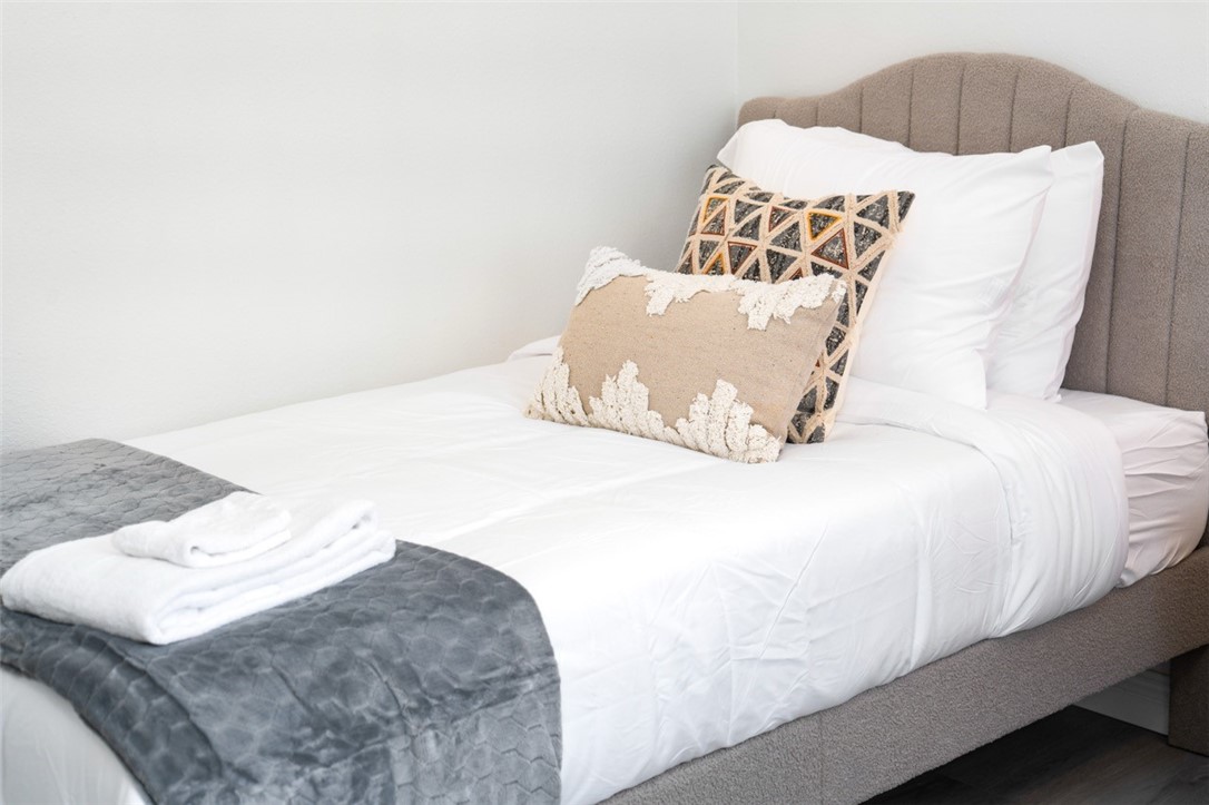 9210 Ralph Street Rosemead, CA 91770 - Photo 8 of 59 a bedroom with a bed and a white couch