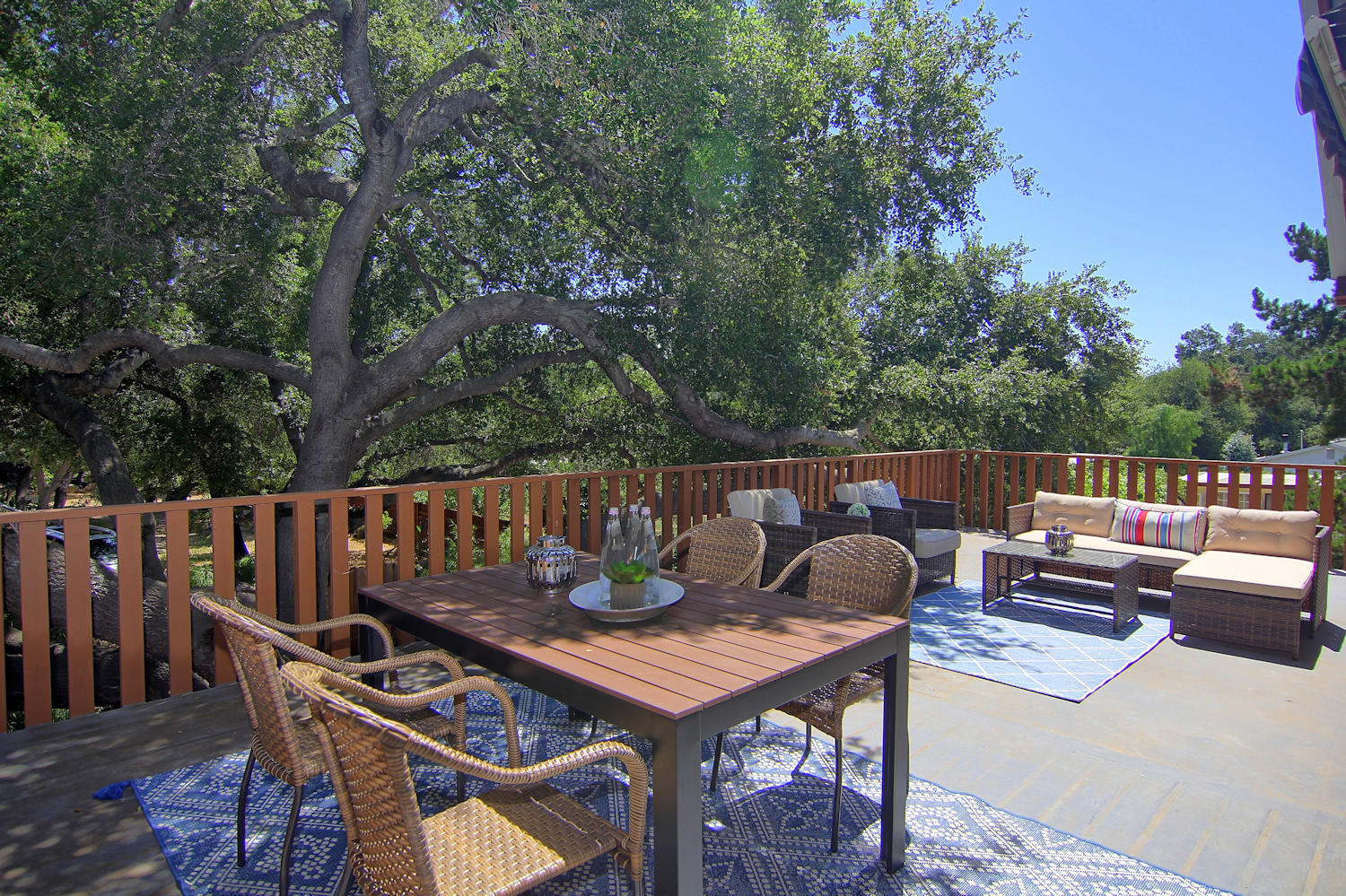 1442 South Rice Road Ojai, CA 93023 - Photo 16 of 50 a balcony with wooden floor and outdoor seating