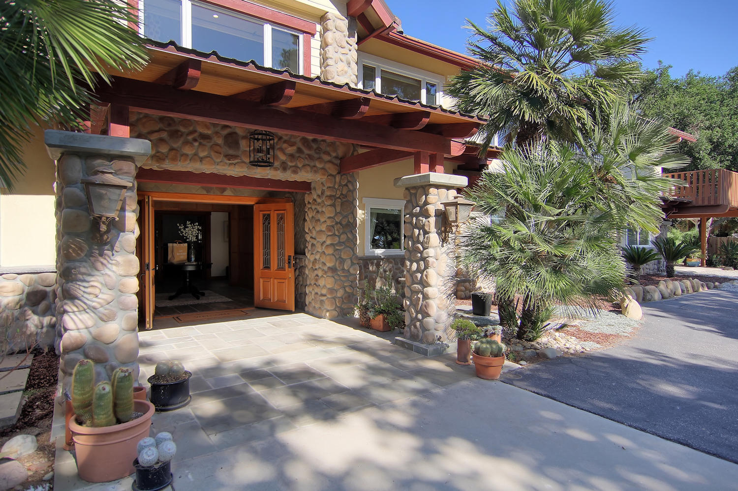 1442 South Rice Road Ojai, CA 93023 - Photo 2 of 50 a view of a house with a yard and potted plants