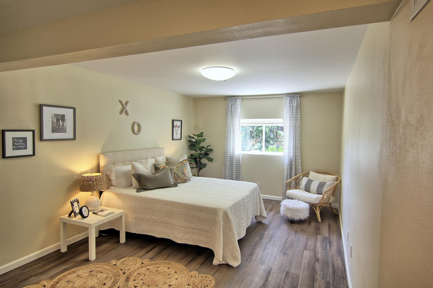 1442 South Rice Road Ojai, CA 93023 - Photo 22 of 50 a bedroom with a bed and wooden floor