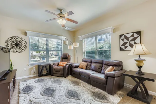 a living room with furniture and a window