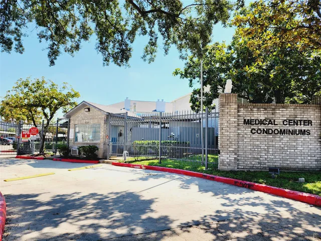 a view of street with tall buildings