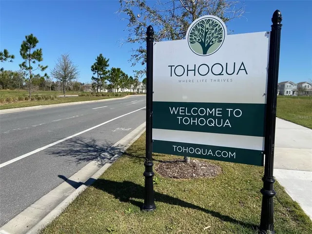 a view of a swimming pool with lounge chairs