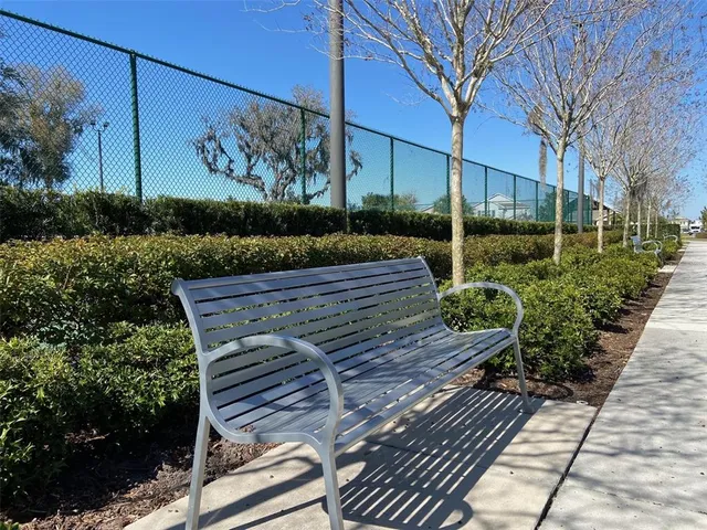 a view of a patio with a table and chairs under an umbrella