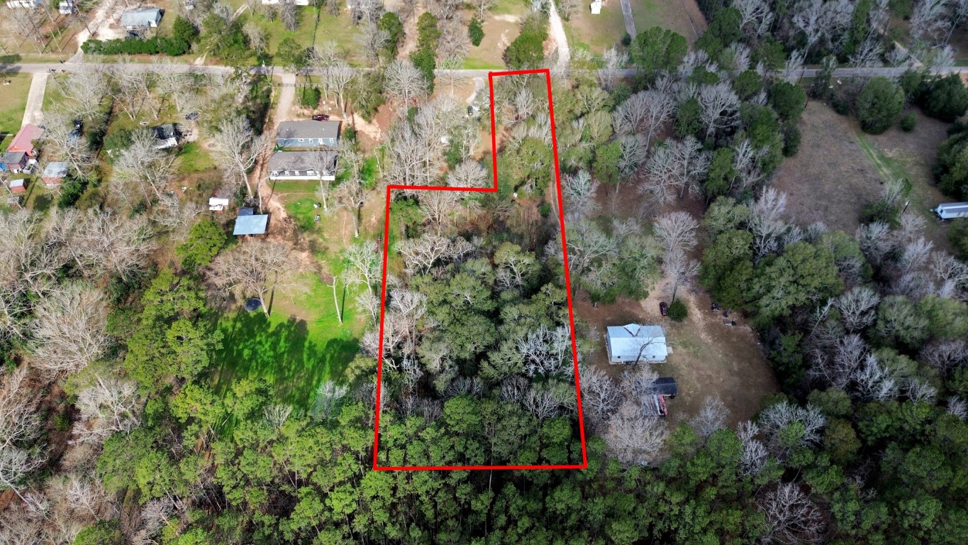10920 Newton Circle Conroe, TX 77303 - Photo 3 of 21 an aerial view of residential houses with outdoor space