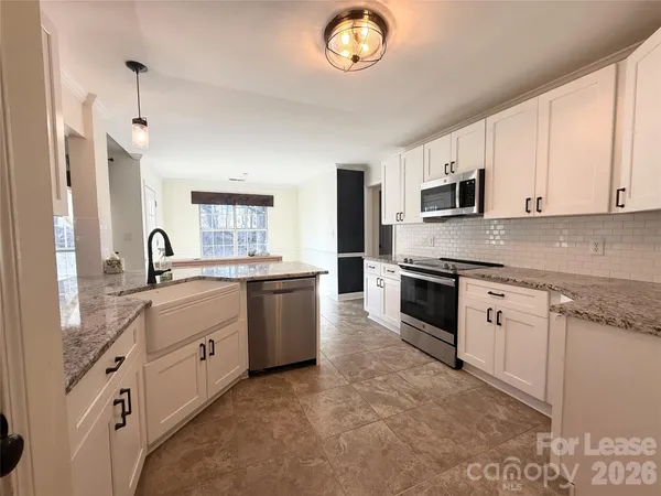 a large kitchen with cabinets