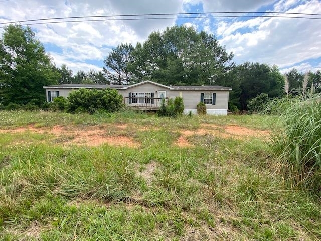 1283 Bodie Rayle Road Elberton, GA 30635 - Photo 1 of 1 a view of a barn in the middle of a yard