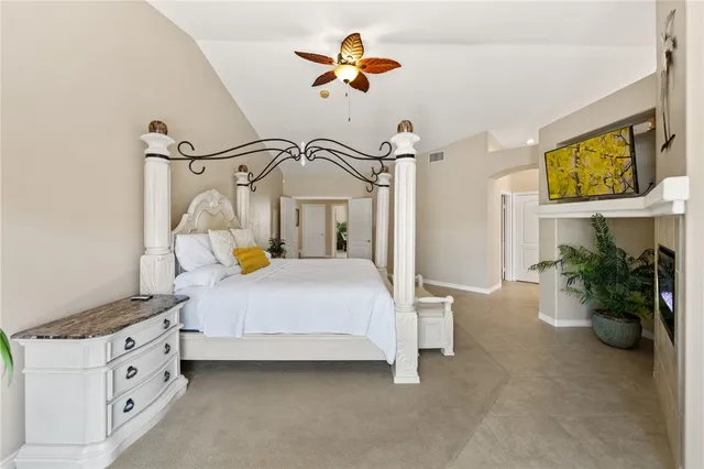 a balcony with furniture and a potted plant