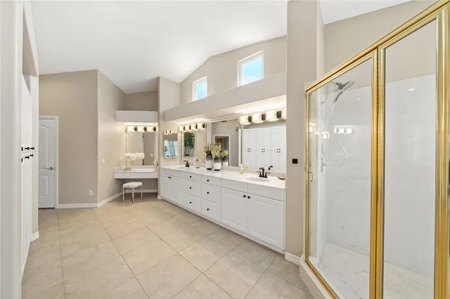 a view of a wooden floor and some trees in the background