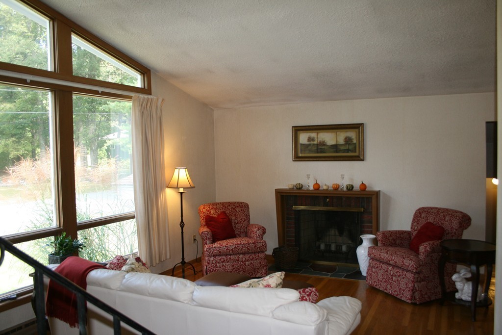 22 Long Meadow Road Chelmsford, MA 01824 - Photo 3 of 12 a living room with furniture a table and a large window