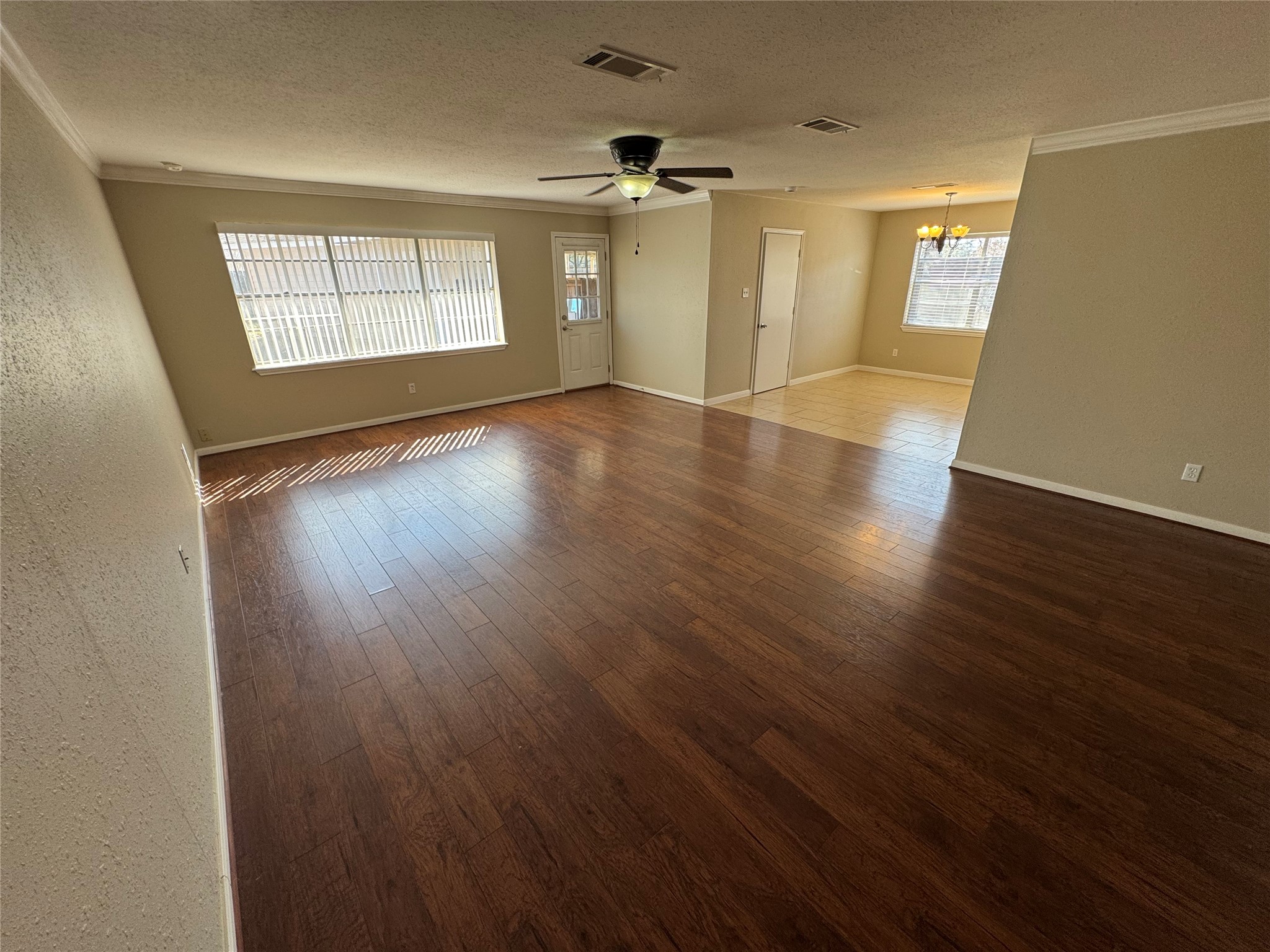 171 Bluebonnet Street Sugar Land, TX 77478 - Photo 12 of 28 an empty room with wooden floor and windows