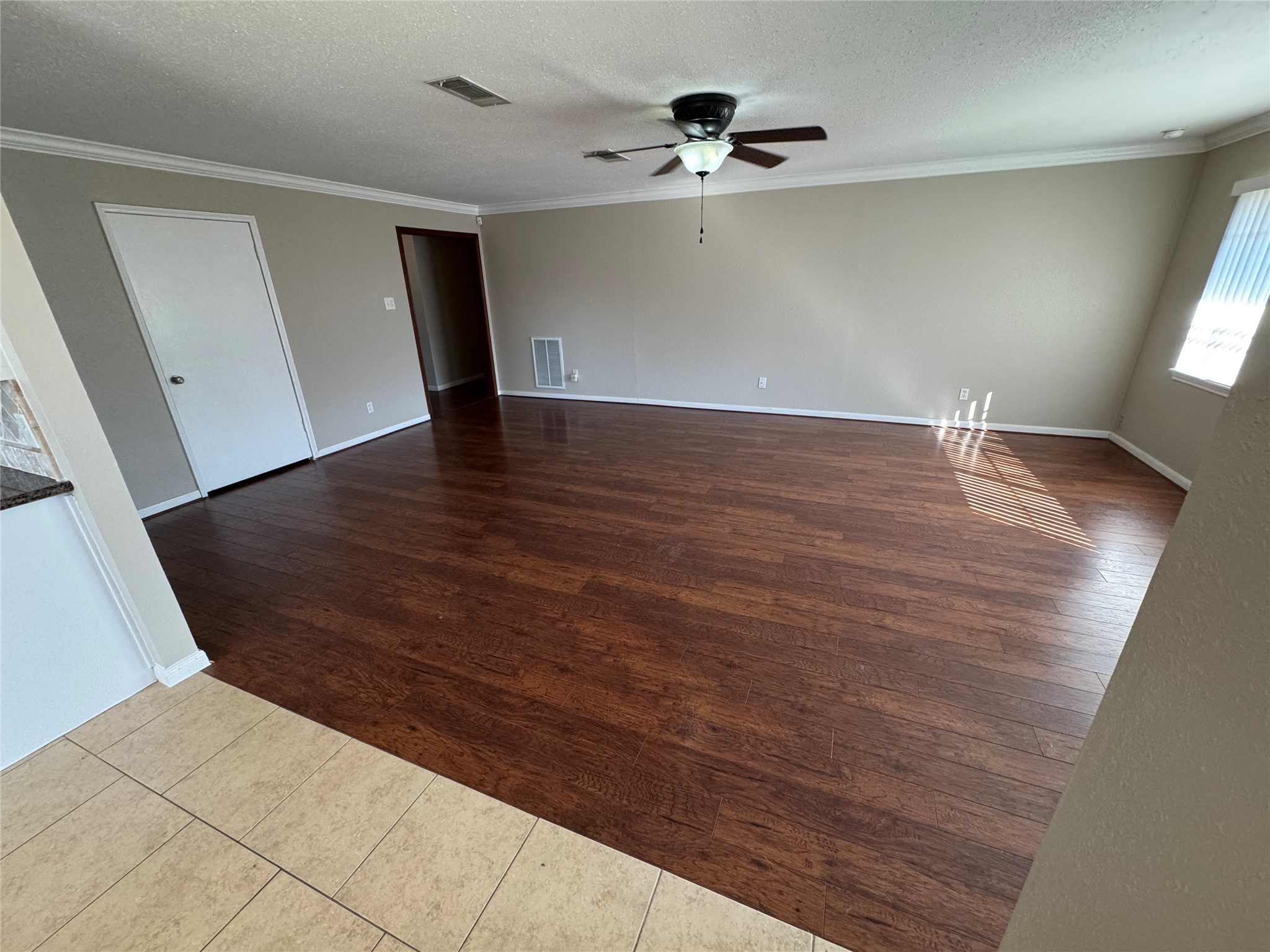 171 Bluebonnet Street Sugar Land, TX 77478 - Photo 13 of 28 a view of a room with wooden floor and staircase