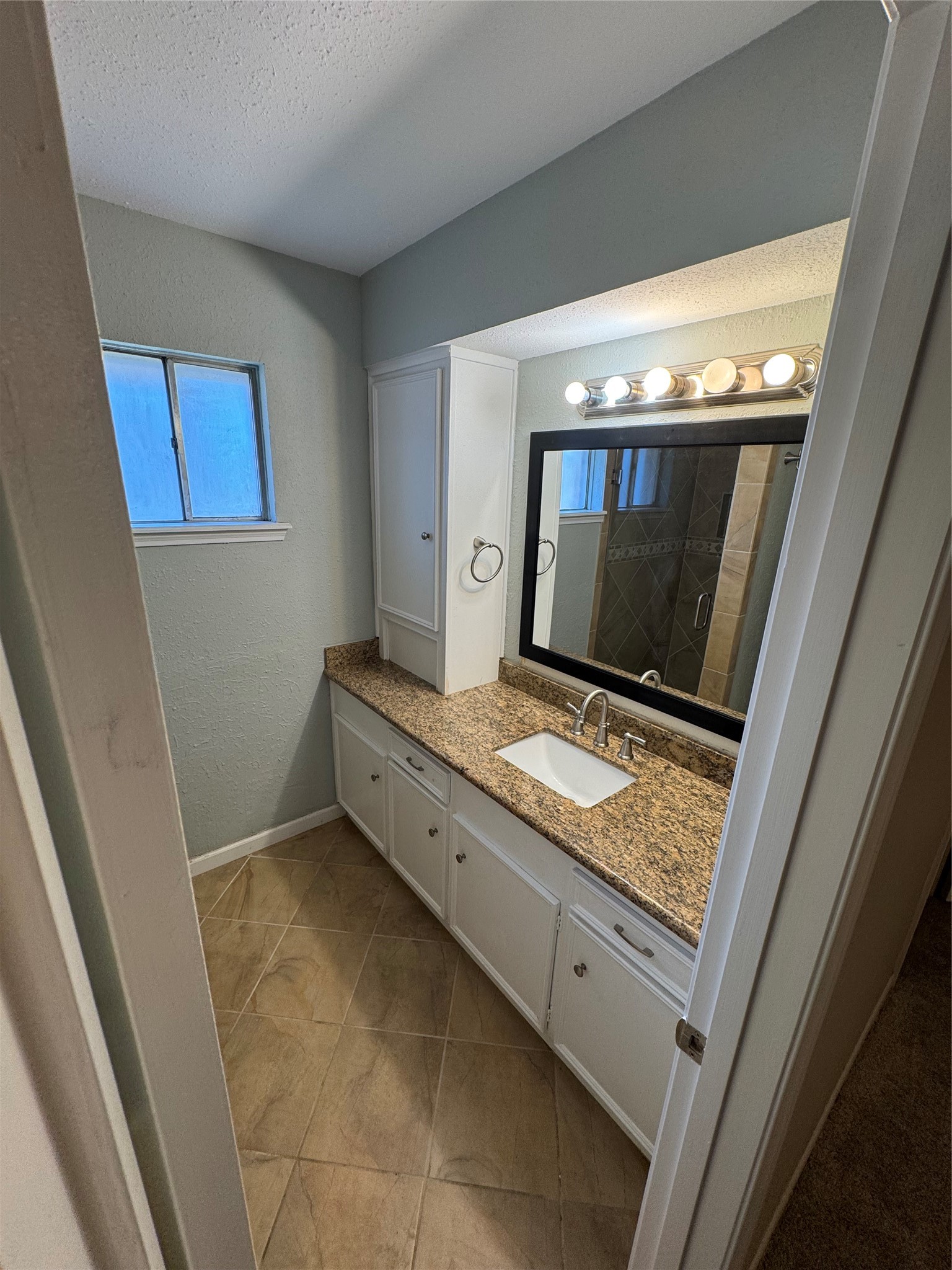 171 Bluebonnet Street Sugar Land, TX 77478 - Photo 15 of 28 a living room with washing machine and a wooden floor
