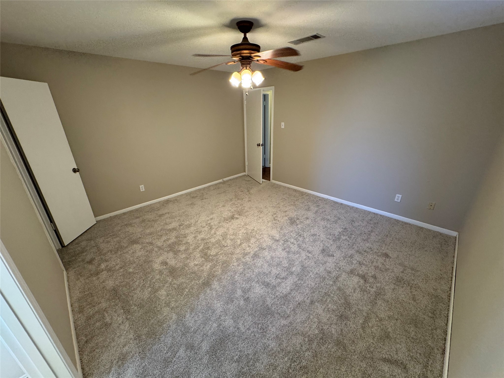 171 Bluebonnet Street Sugar Land, TX 77478 - Photo 20 of 28 a view of empty room with a ceiling fan