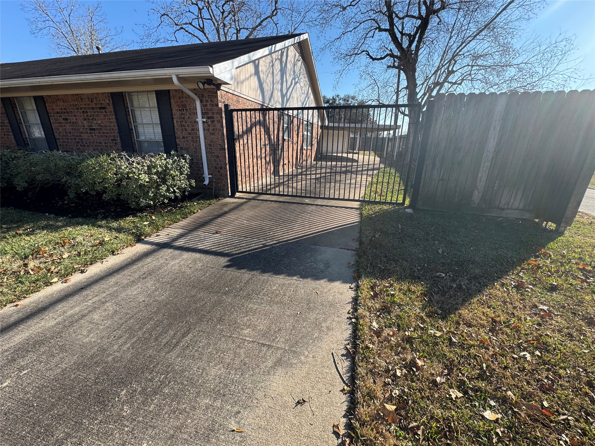 171 Bluebonnet Street Sugar Land, TX 77478 - Photo 4 of 28 a view of entrance gate of house and car parked