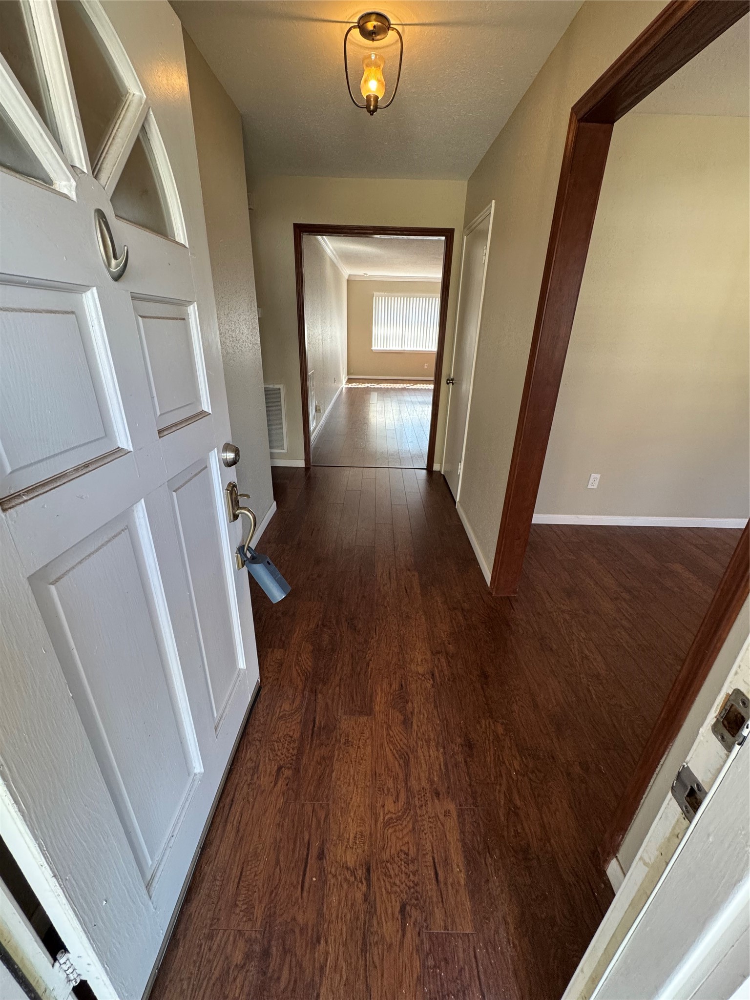171 Bluebonnet Street Sugar Land, TX 77478 - Photo 6 of 28 a view of a hallway with wooden floor and staircase