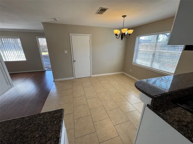 a view of a livingroom with furniture and chandelier