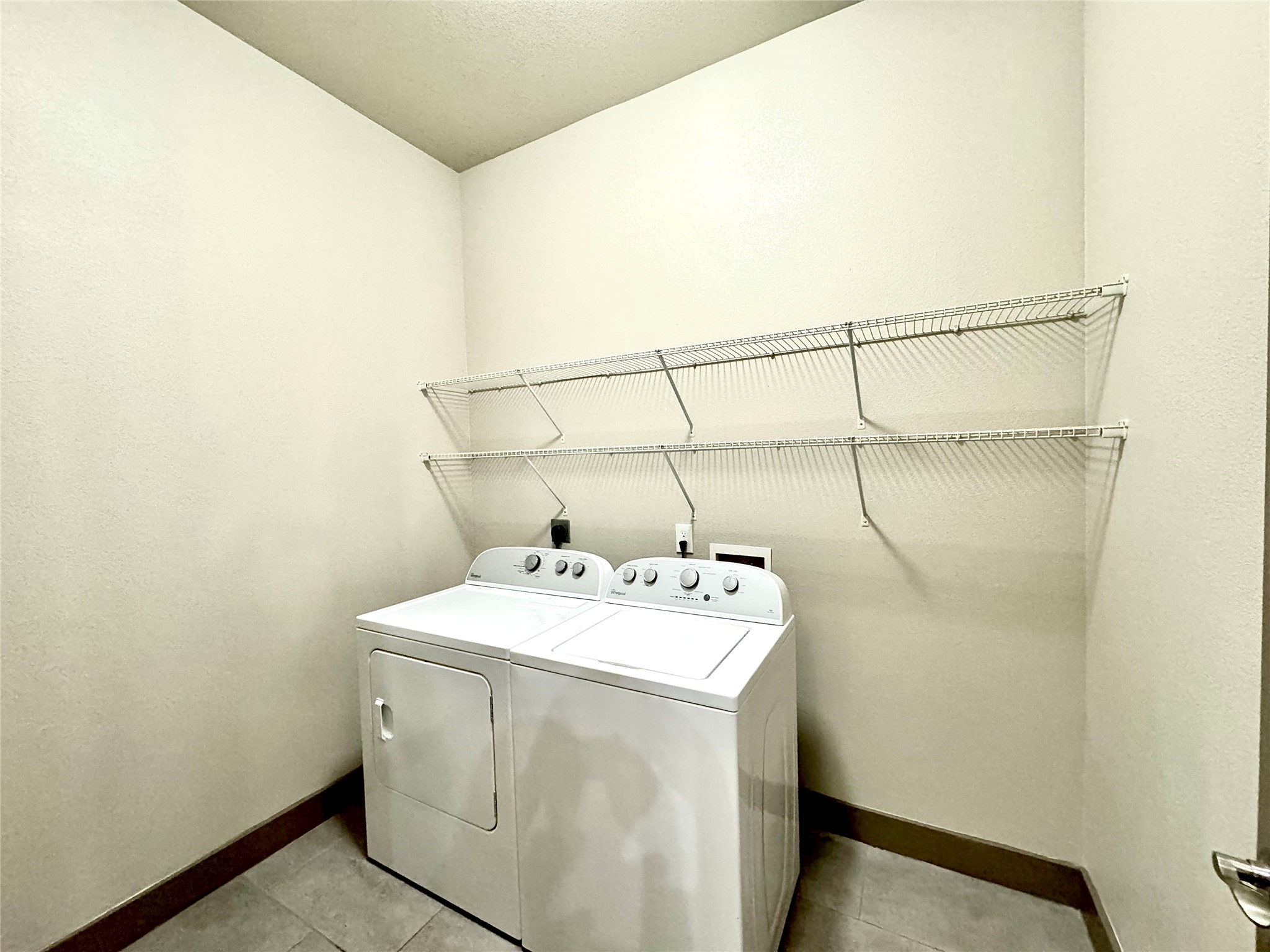 2033 South Gessner Road, Unit 2108 Houston, TX 77063 - Photo 6 of 21 a utility room with dryer and washer